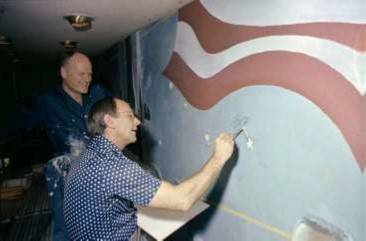 mccall_with_bean_painting_astronaut_pin_on_jsc_mural_1979