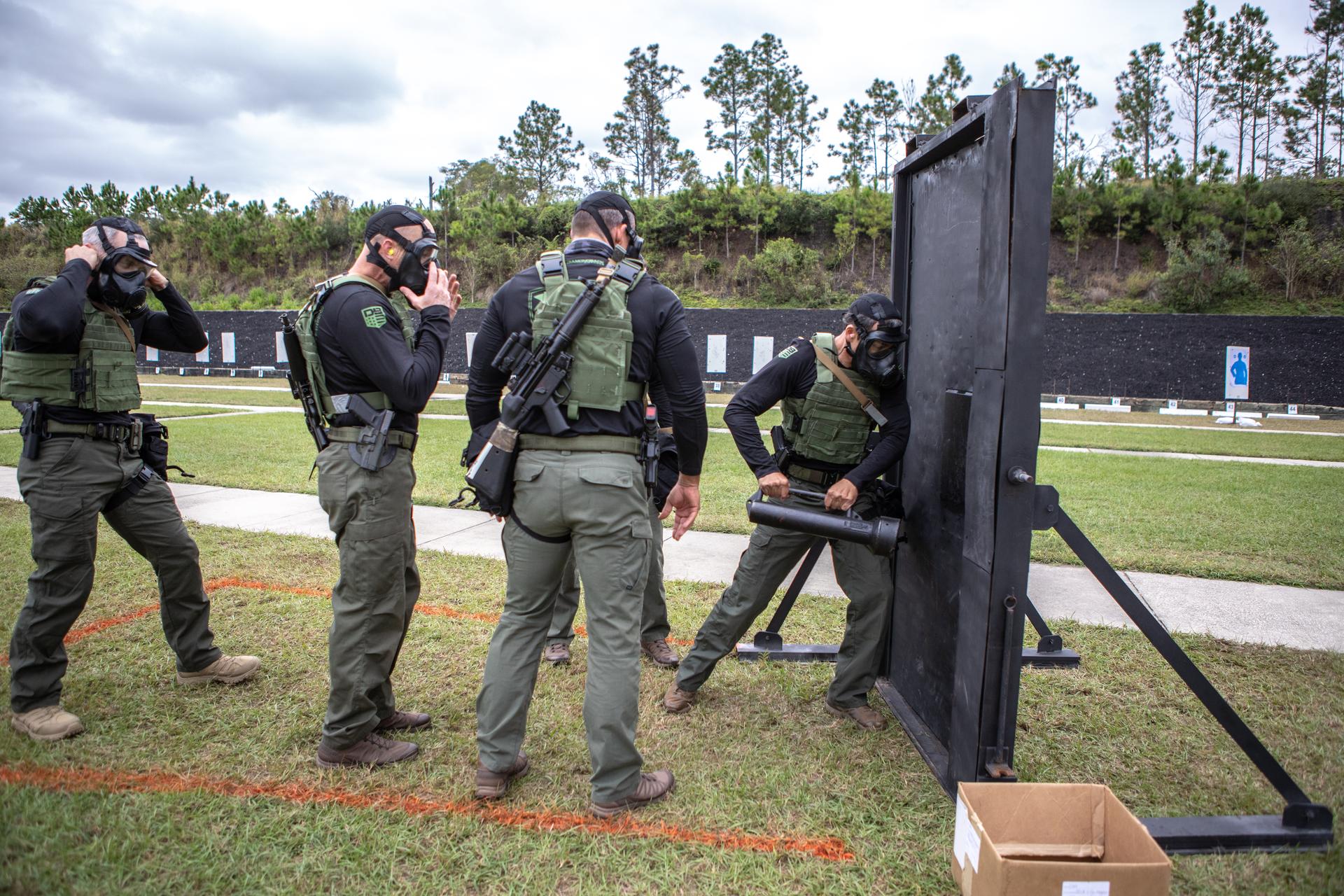 ERT team members prepare to break through a barricade at the 2019 SWAT Round-Up International in Orlando, Florida.