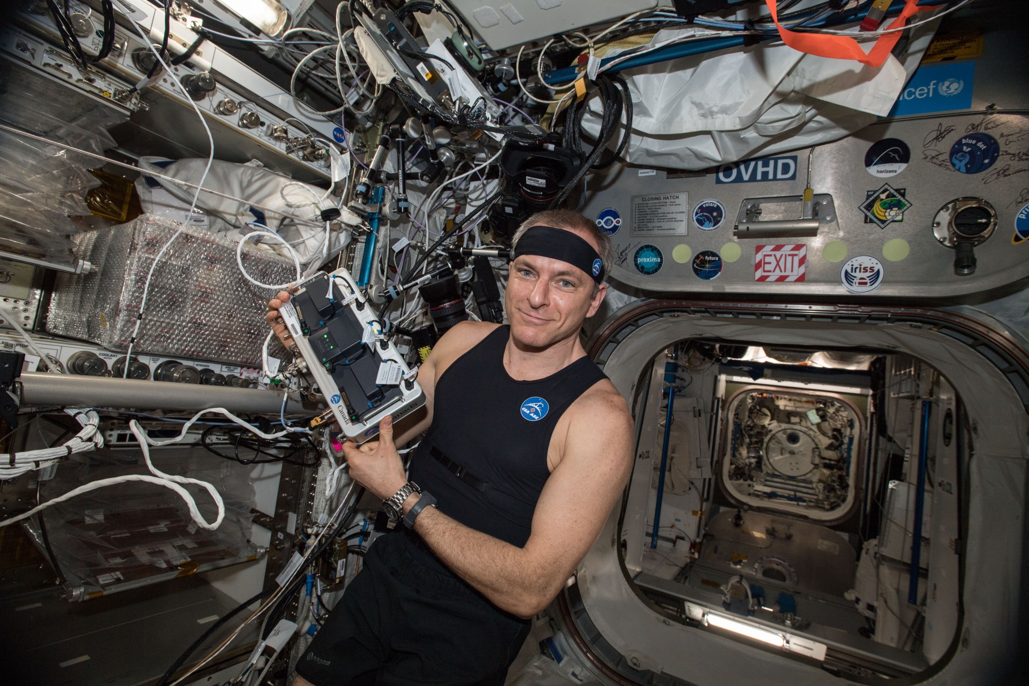 astronaut David Saint-Jacques wearing the Bio-Monitor inside the space station