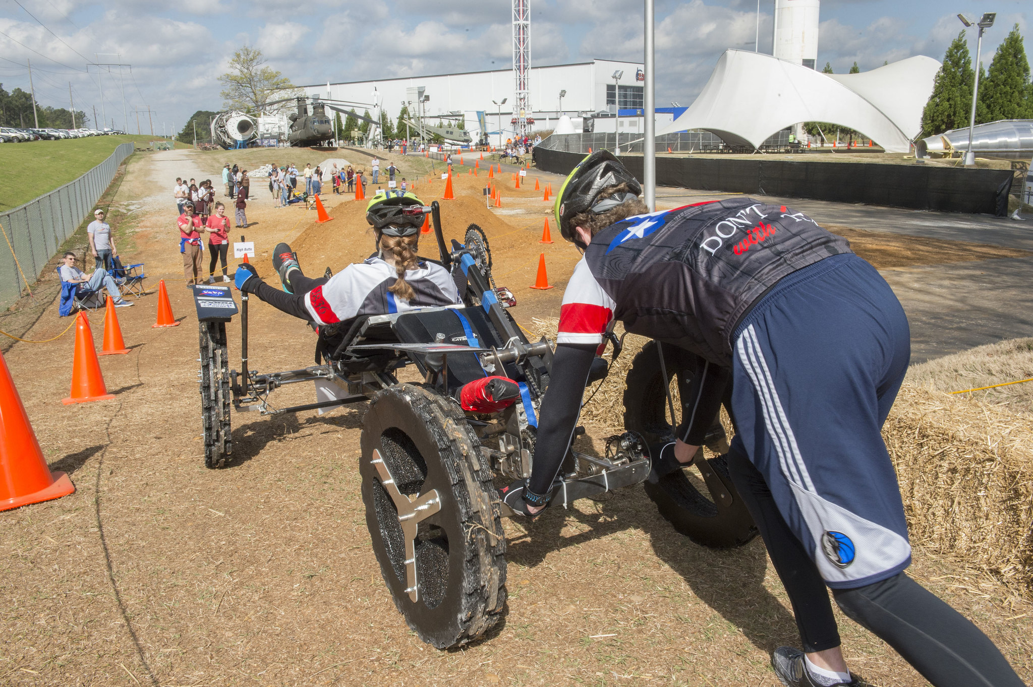 2 people on a human-powered rover