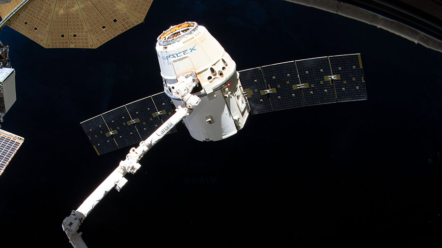 The SpaceX Dragon cargo craft is pictured moments before its release