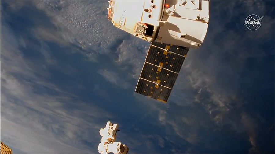 The SpaceX Dragon cargo craft is pictured moments after its release