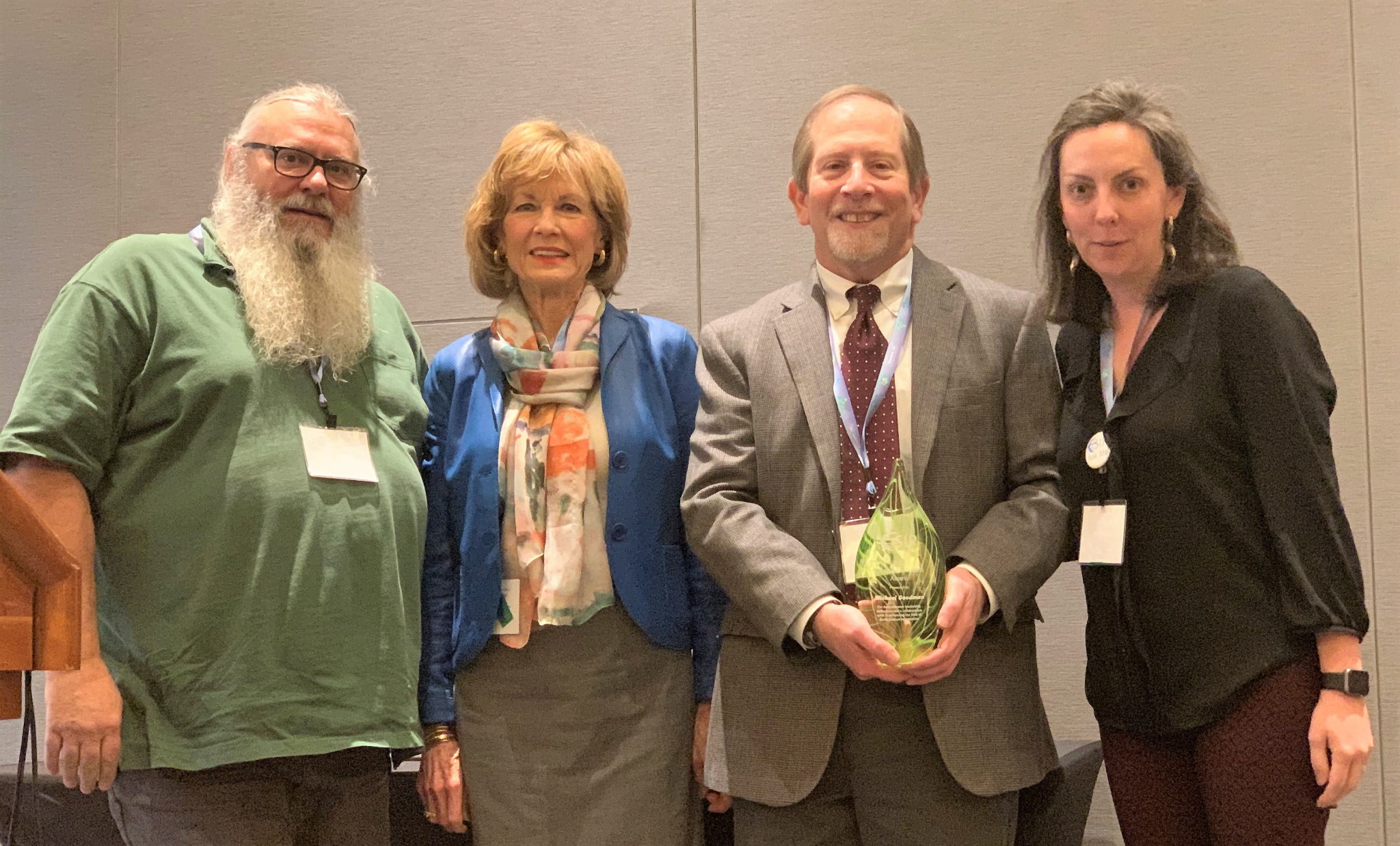 Michael Goodman, center right, receives the Martha Maiden Award at the 2020 Earth Science Information Partners Winter Meeting.