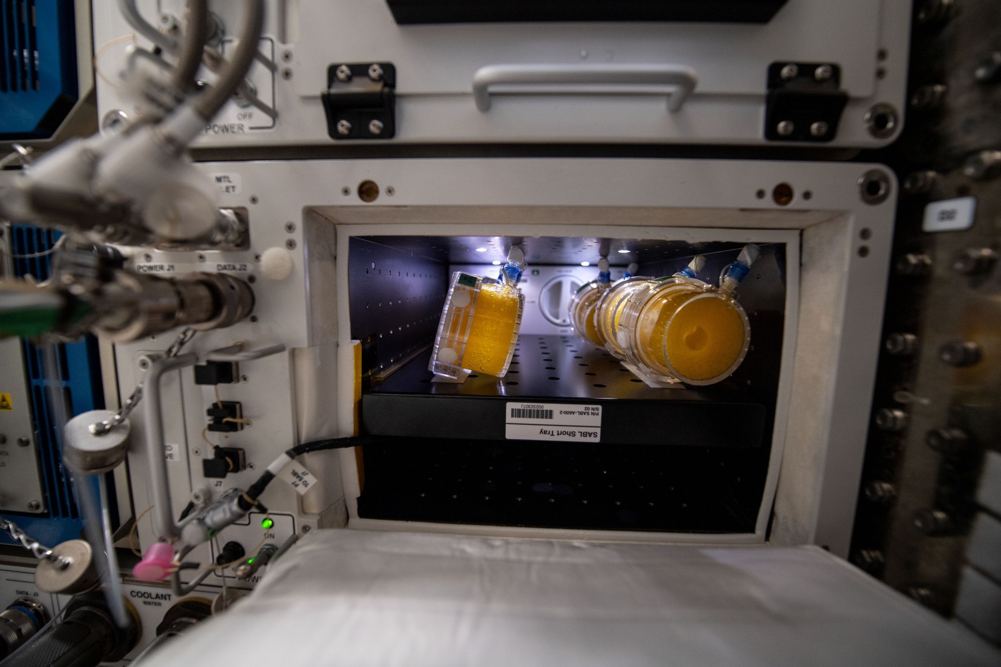 containers with bio nutrients samples inside space station
