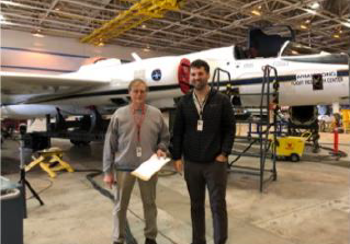 Monte Bateman (LIP instrument) and Tyler Latsha in front of the ER-2 during IMPACTS integration. Peter Pantina