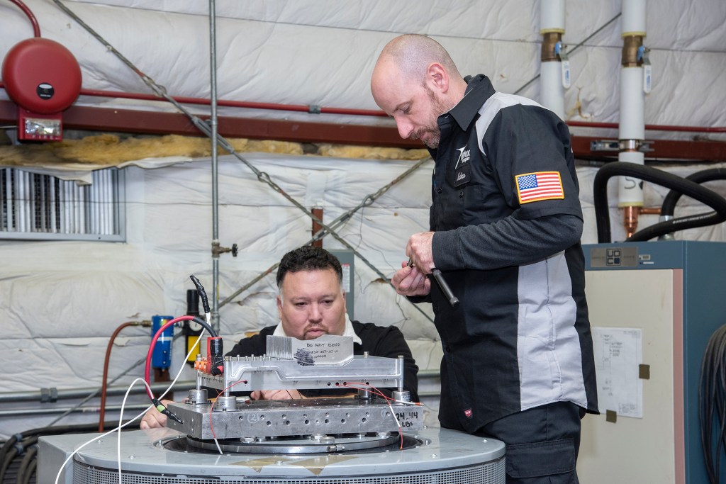 Engineers from NASA?s Armstrong Flight Research Center and Empirical Systems Aerospace prepare a cruise motor controller.