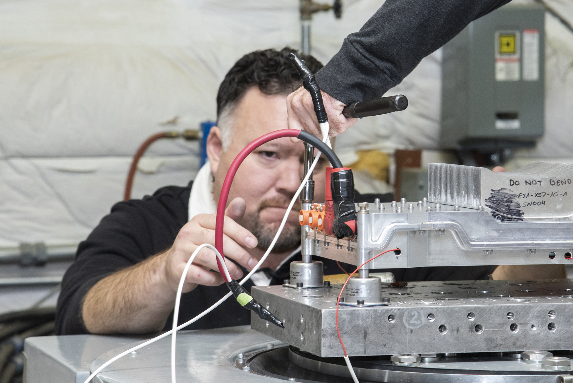 Engineers from NASA?s Armstrong Flight Research Center and Empirical Systems Aerospace prepare a cruise motor controller.