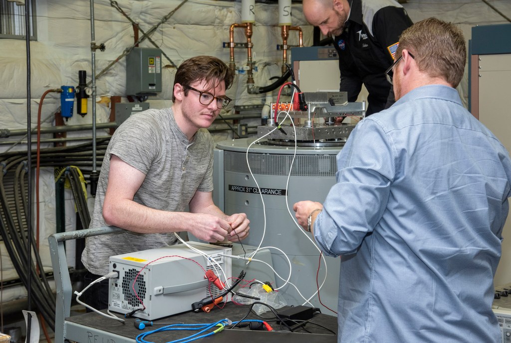 Engineers from NASA?s Armstrong Flight Research Center and Empirical Systems Aerospace prepare a cruise motor controller.
