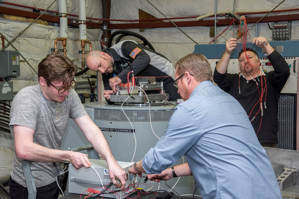 Engineers from NASA?s Armstrong Flight Research Center and Empirical Systems Aerospace prepare a cruise motor controller.