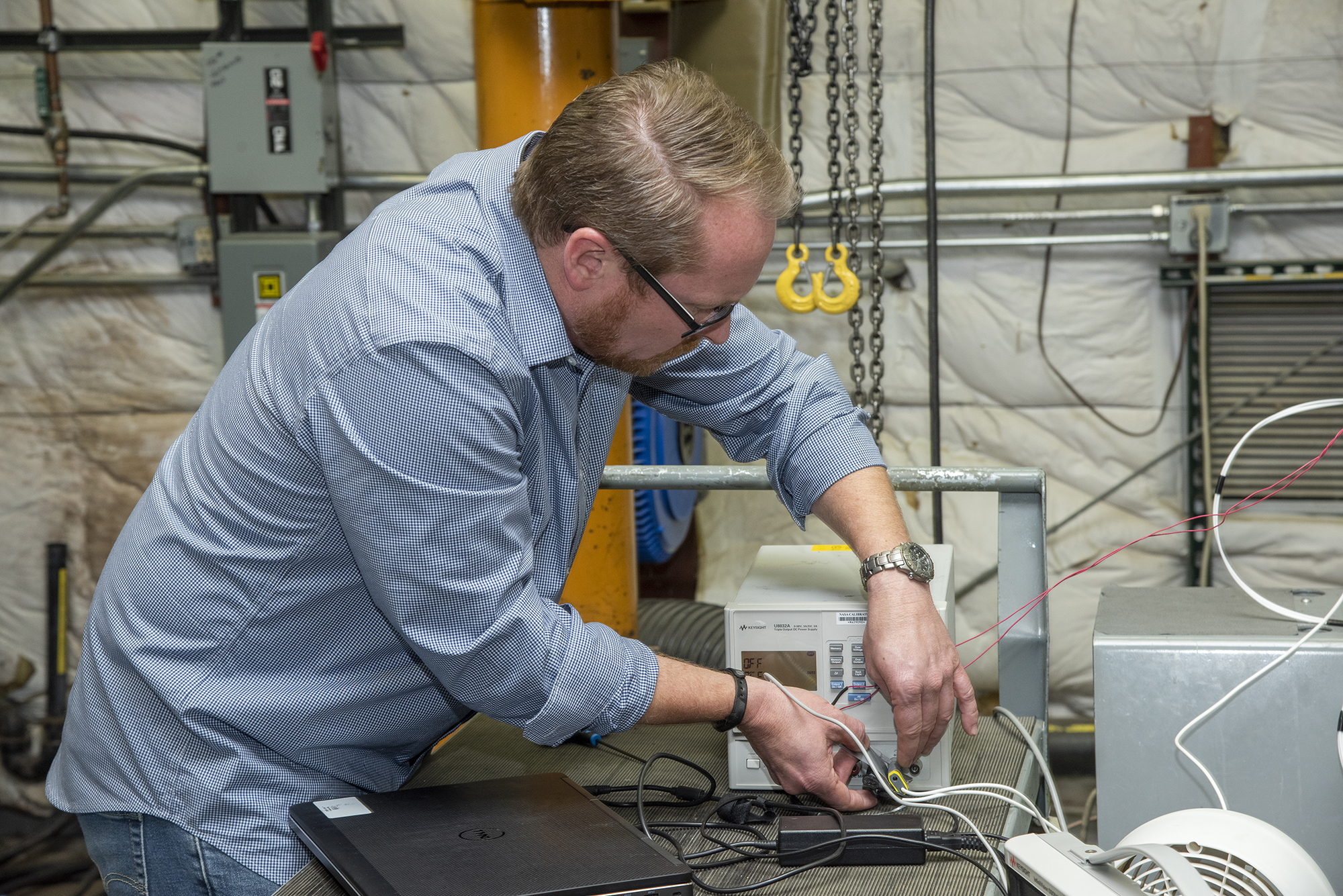 Engineers from NASA?s Armstrong Flight Research Center and Empirical Systems Aerospace prepare a cruise motor controller.