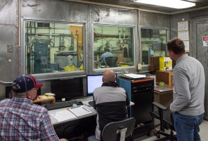 Engineers monitor data during vibration testing of a cruise motor controller for the X-57 Maxwell.
