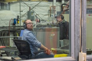 Engineers monitor data during vibration testing of a cruise motor controller for the X-57 Maxwell.
