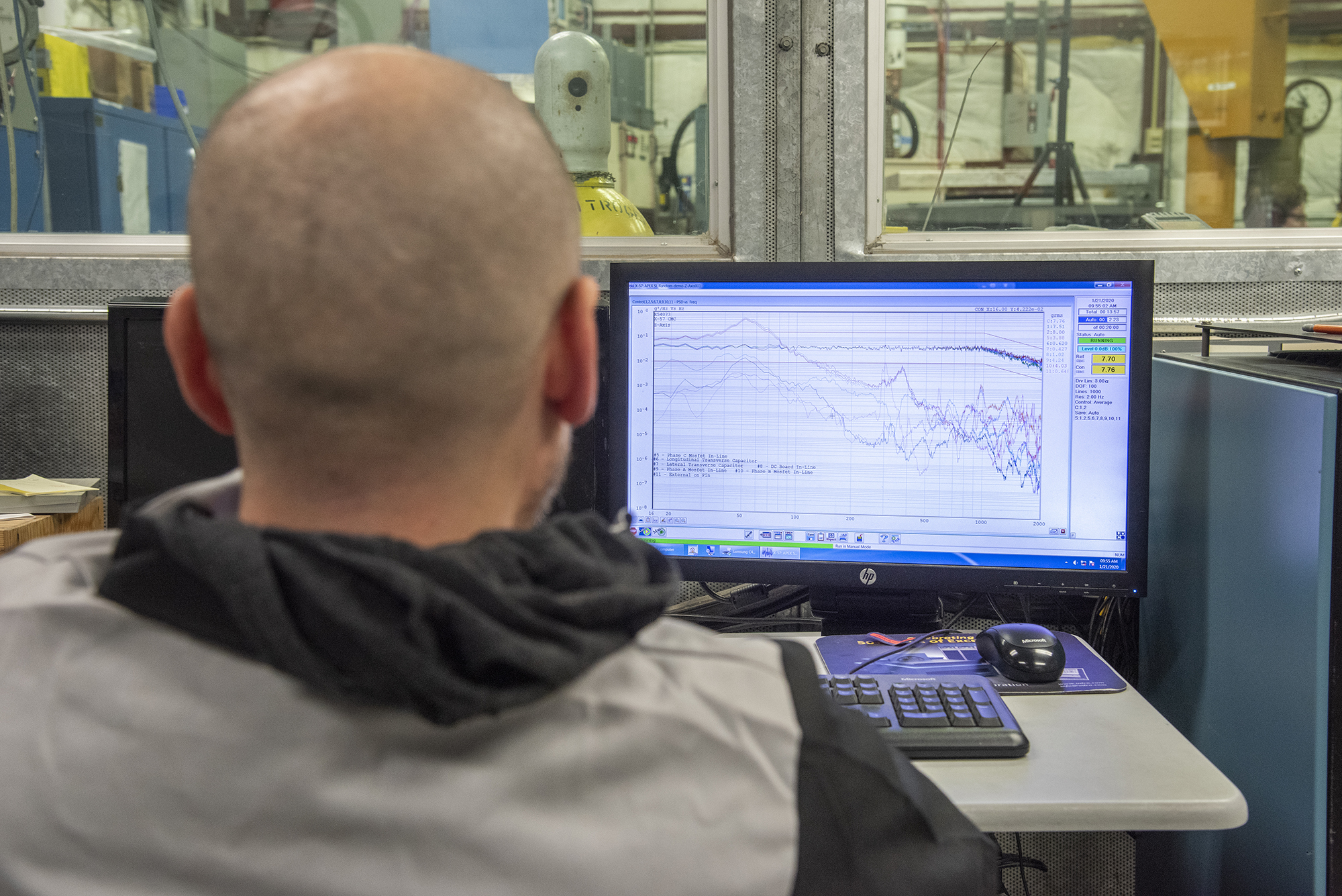 Engineers monitor data during vibration testing of a cruise motor controller for the X-57 Maxwell.