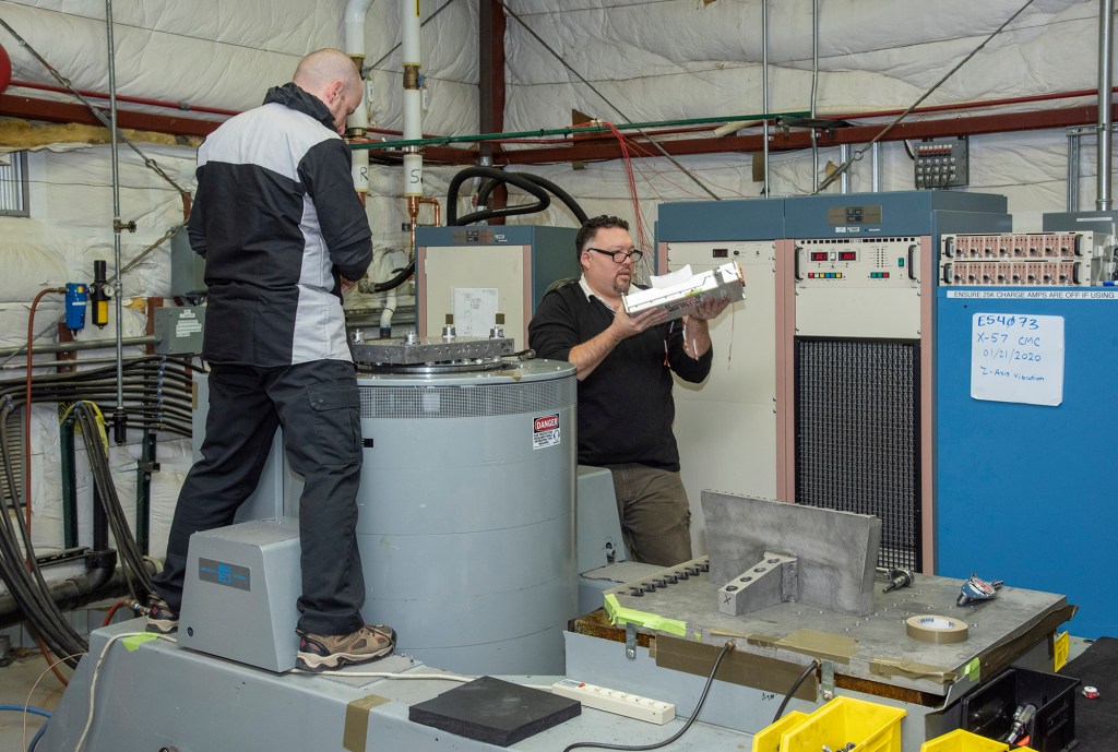 Engineers prepare a cruise motor controller, planned to be used on NASA?s all-electric X-57 Maxwell.