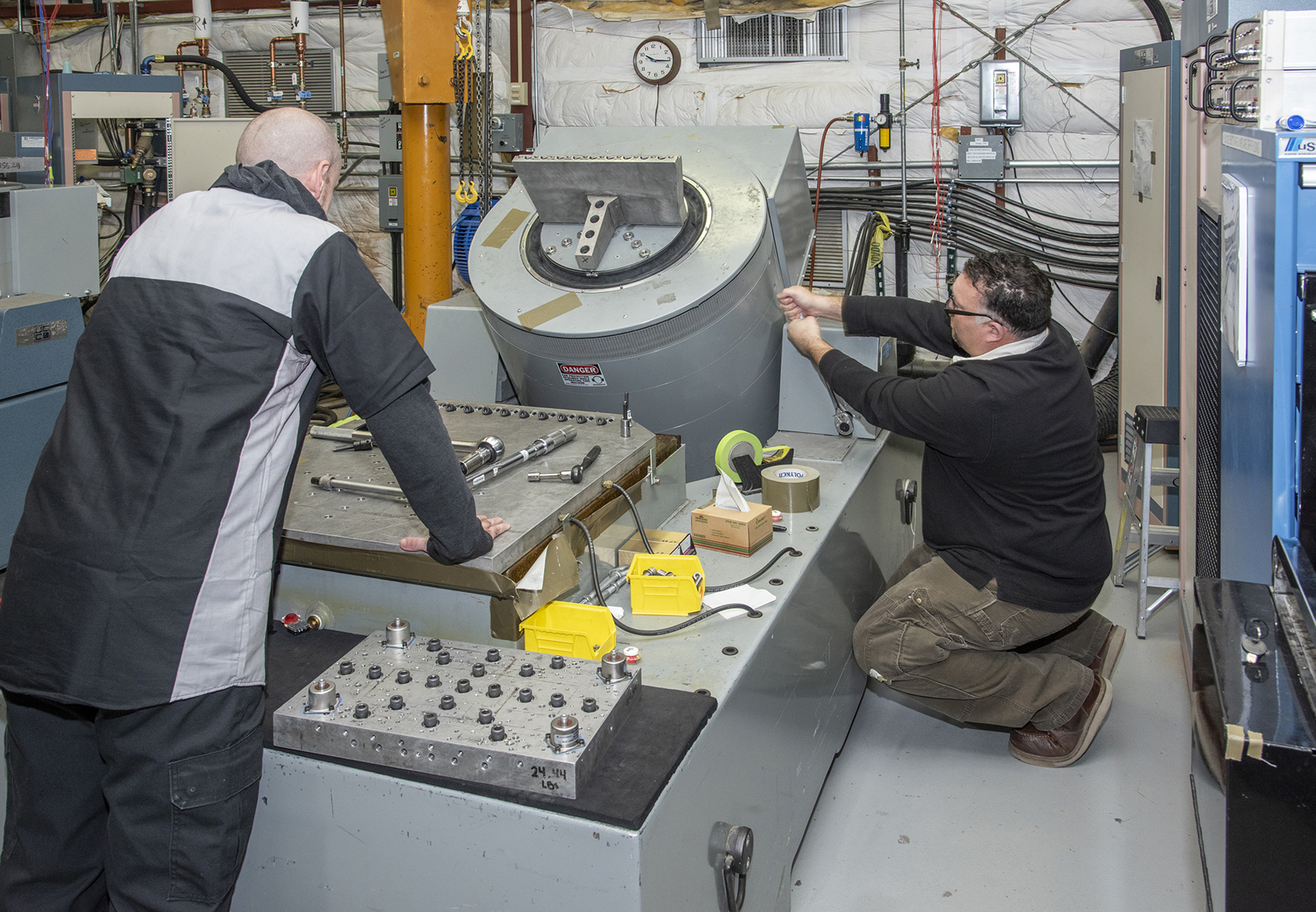 Engineers prepare a cruise motor controller, planned to be used on NASA?s all-electric X-57 Maxwell.