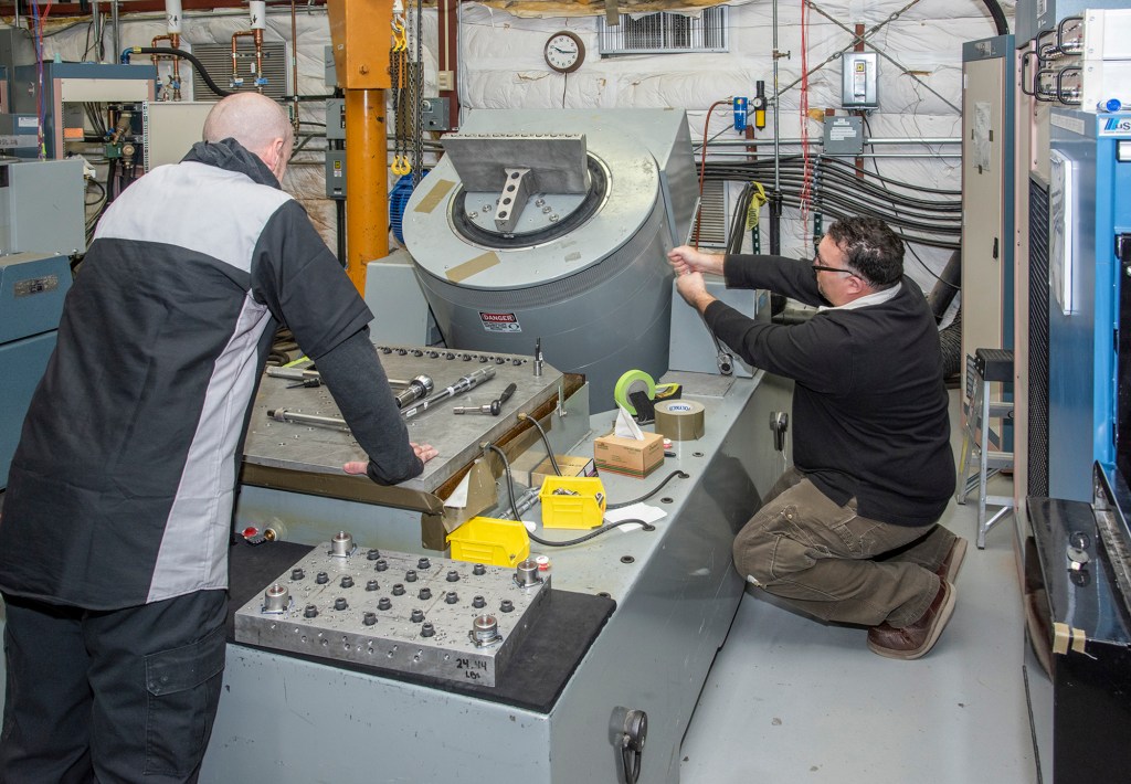Engineers prepare a cruise motor controller, planned to be used on NASA?s all-electric X-57 Maxwell.