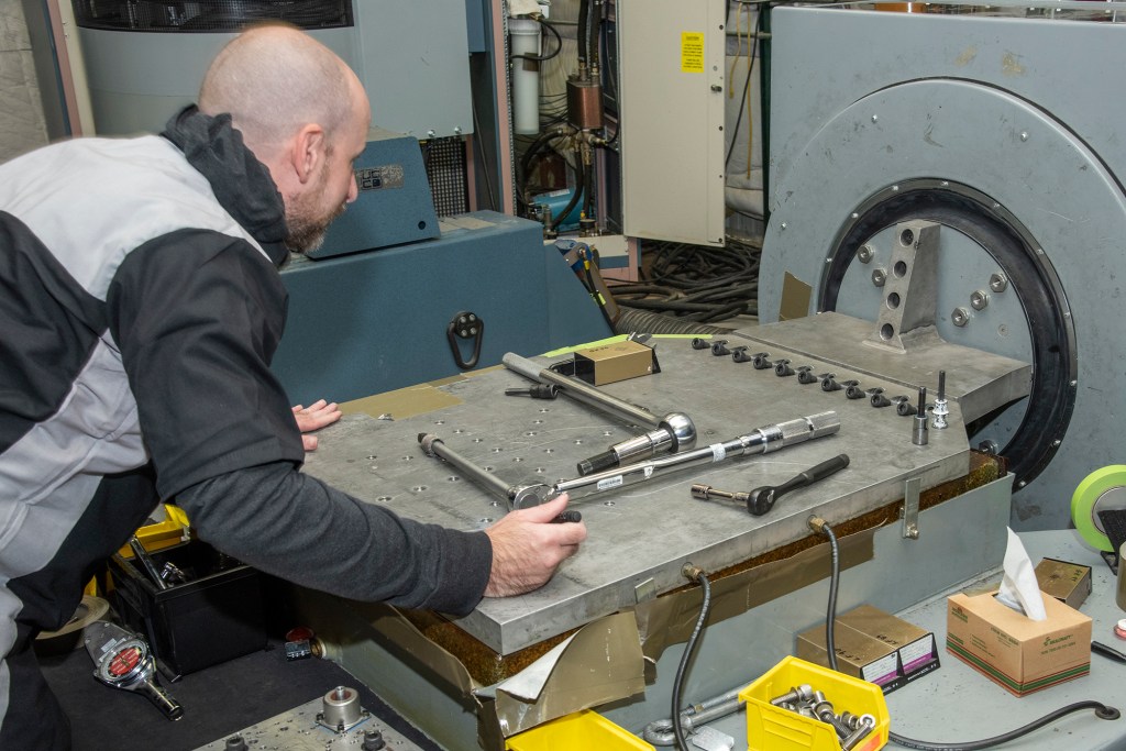 Engineers prepare a cruise motor controller for the X-57.