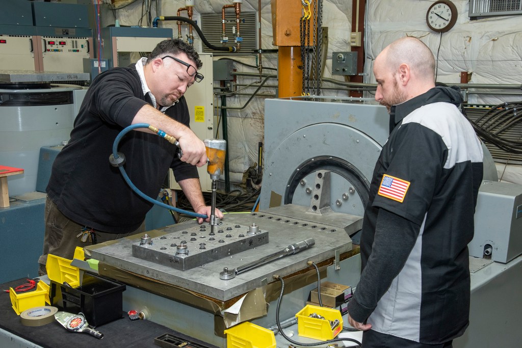 Engineers prepare a cruise motor controller for the X-57.