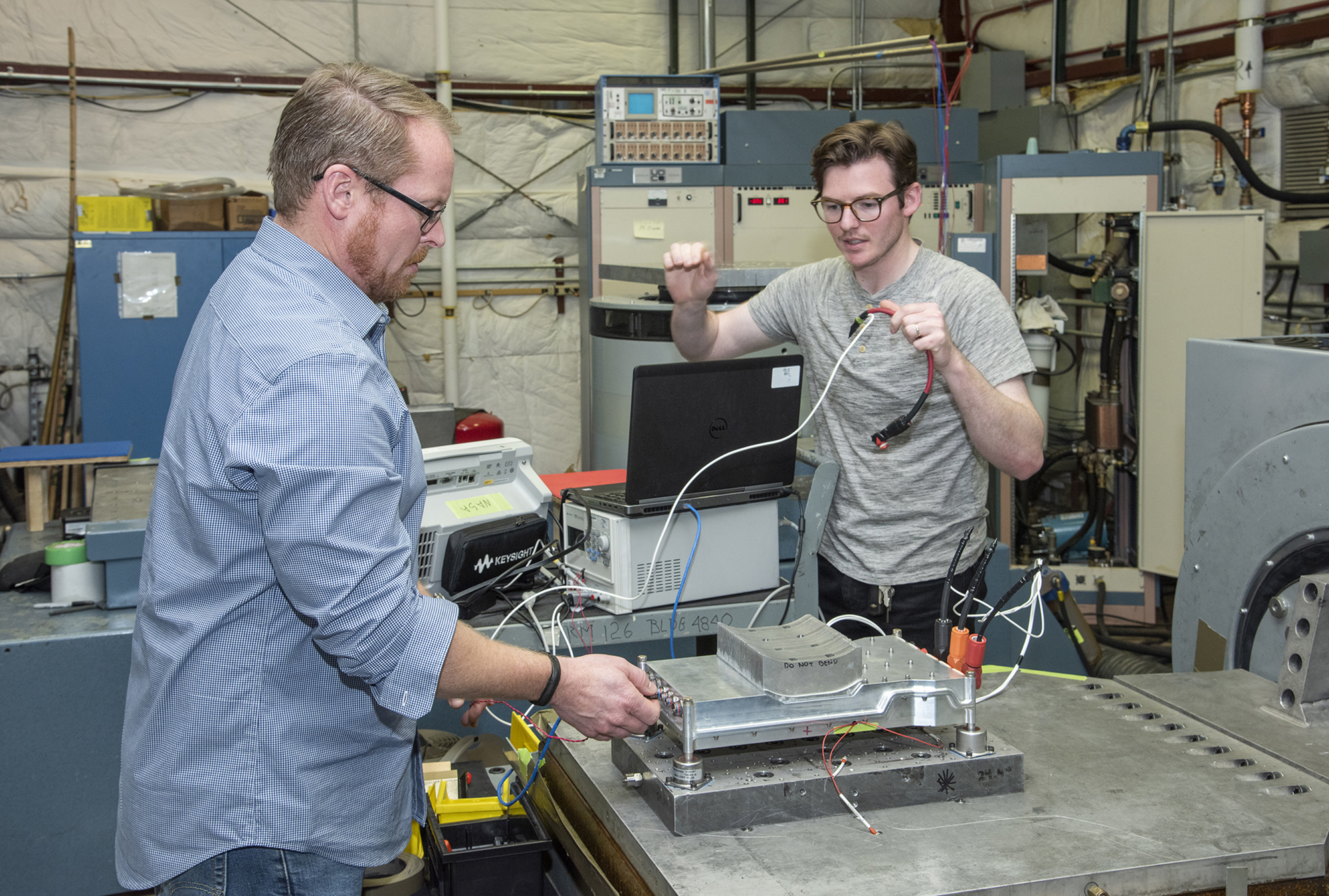 Engineers prepare a cruise motor controller for the X-57.