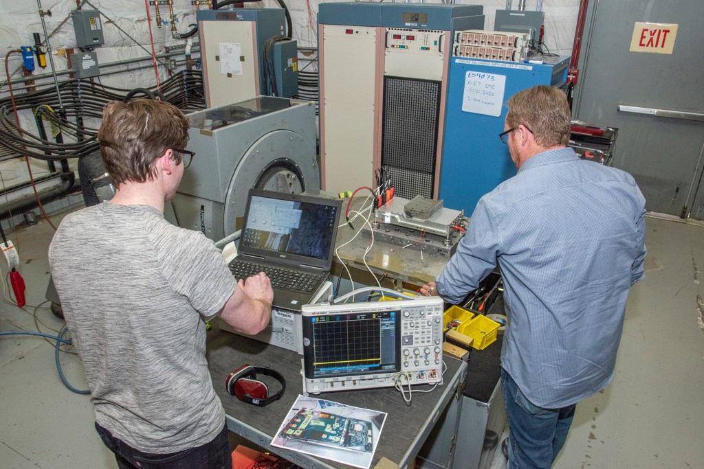 Engineers prepare a cruise motor controller, planned to be used on NASA?s all-electric X-57 Maxwell.