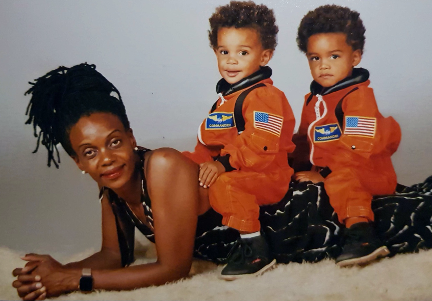 woman and two young boys