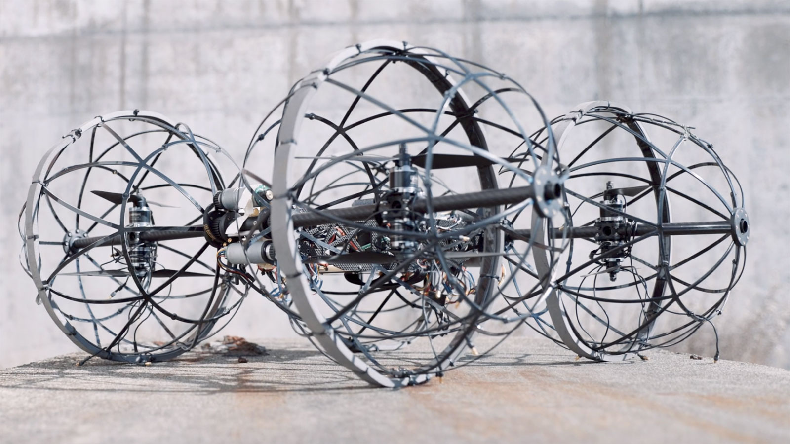Team CoSTAR brought a rolling/flying robot called Drivocopter 