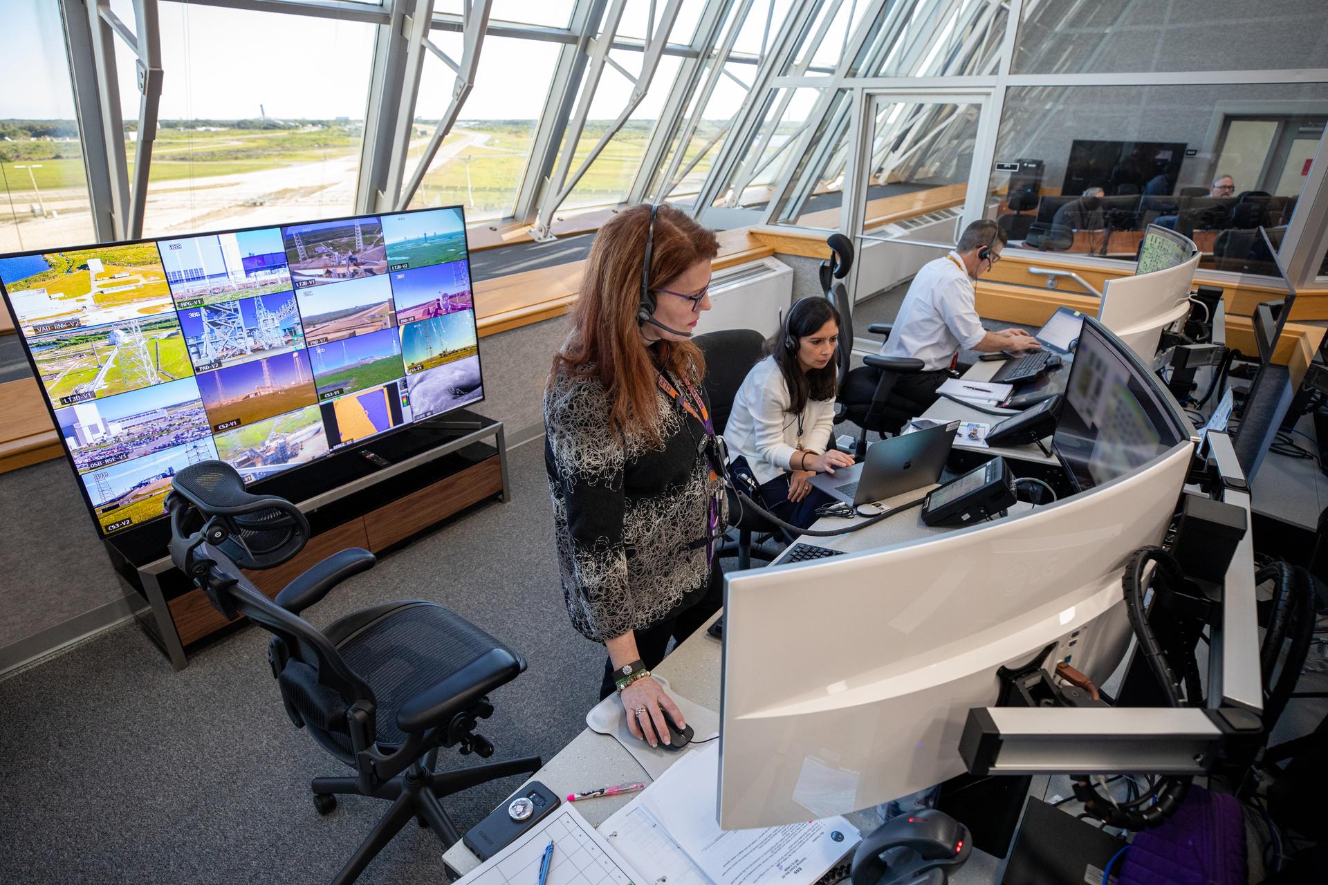 Artemis I Launch Director Charlie Blackwell-Thompson (left) stands at the launch console.