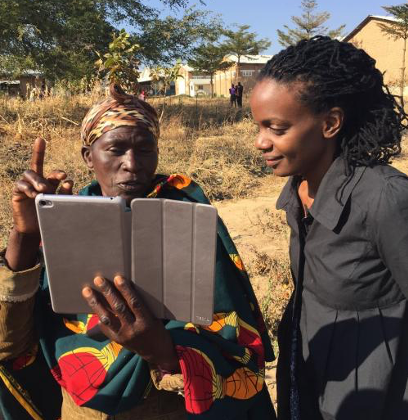 two people looking at a tablet computer