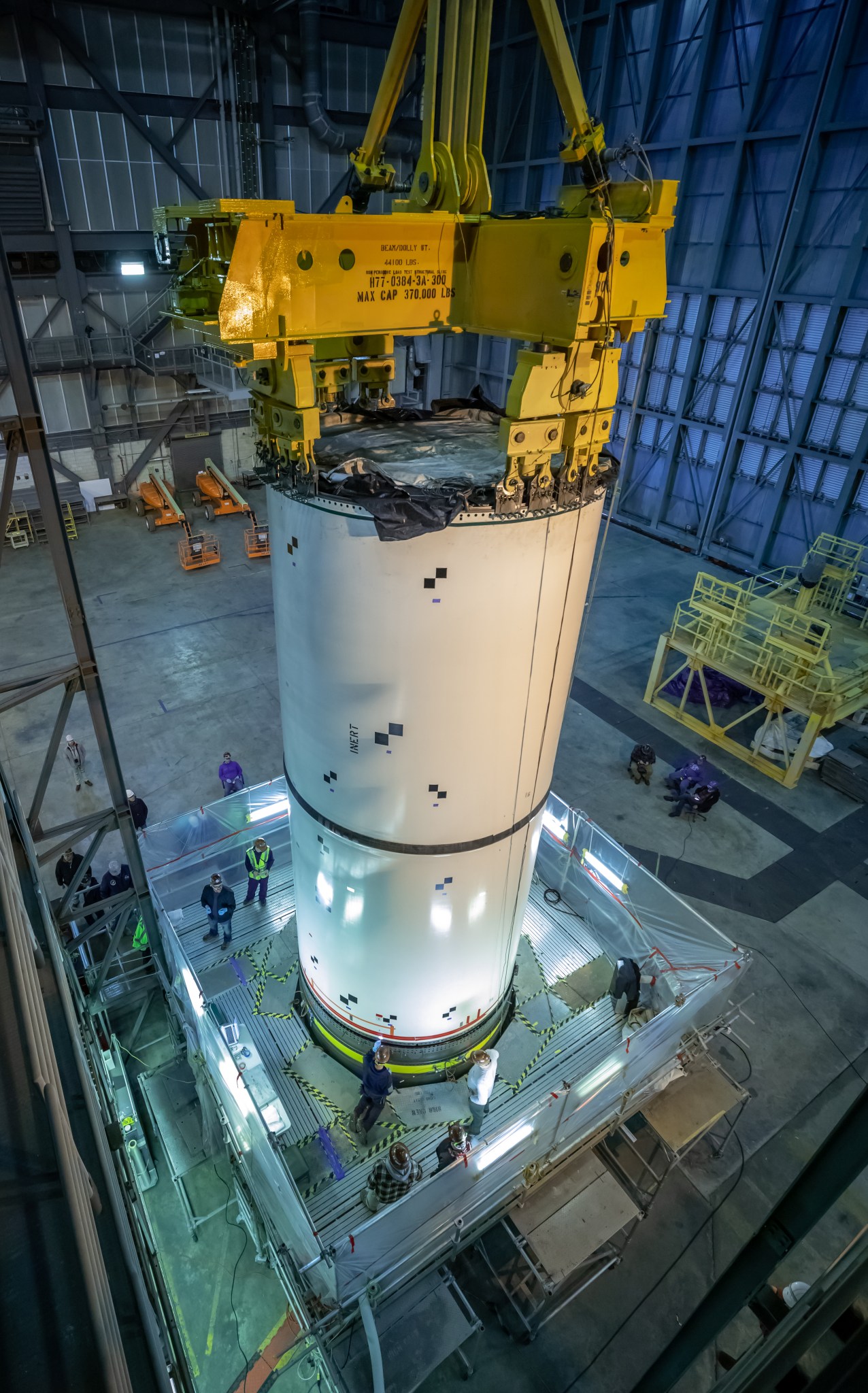 Artemis teams practice stacking full-scale replicas of Space Launch System boosters in the Vehicle Assembly Building.