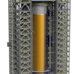 The 537,000-gallon qualification test version of the liquid hydrogen tank for Space Launch System’s core stage willbe positioned between the towers of Test Stand 4693.