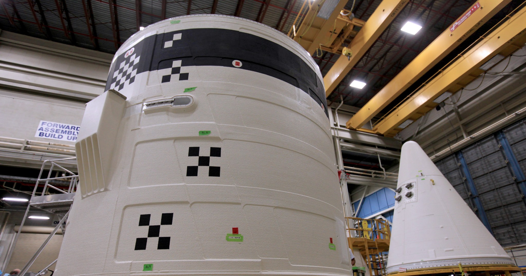 Once mated, the forward skirt (front) and the nose cap (back) form the forward assembly, or top section, of the SLS solid rocket boosters.