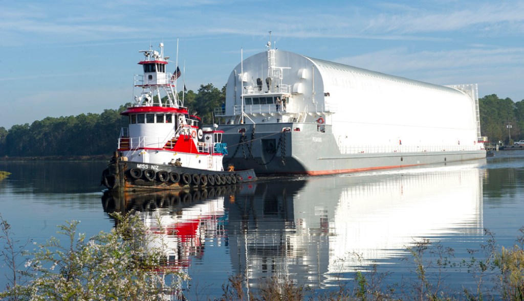 The usable cargo deck length for Pegasus is 240 feet (73.15 meters). It's usable cargo deck width is 36 feet (10.97 meters) and the height is 41 feet (12.49 meters).