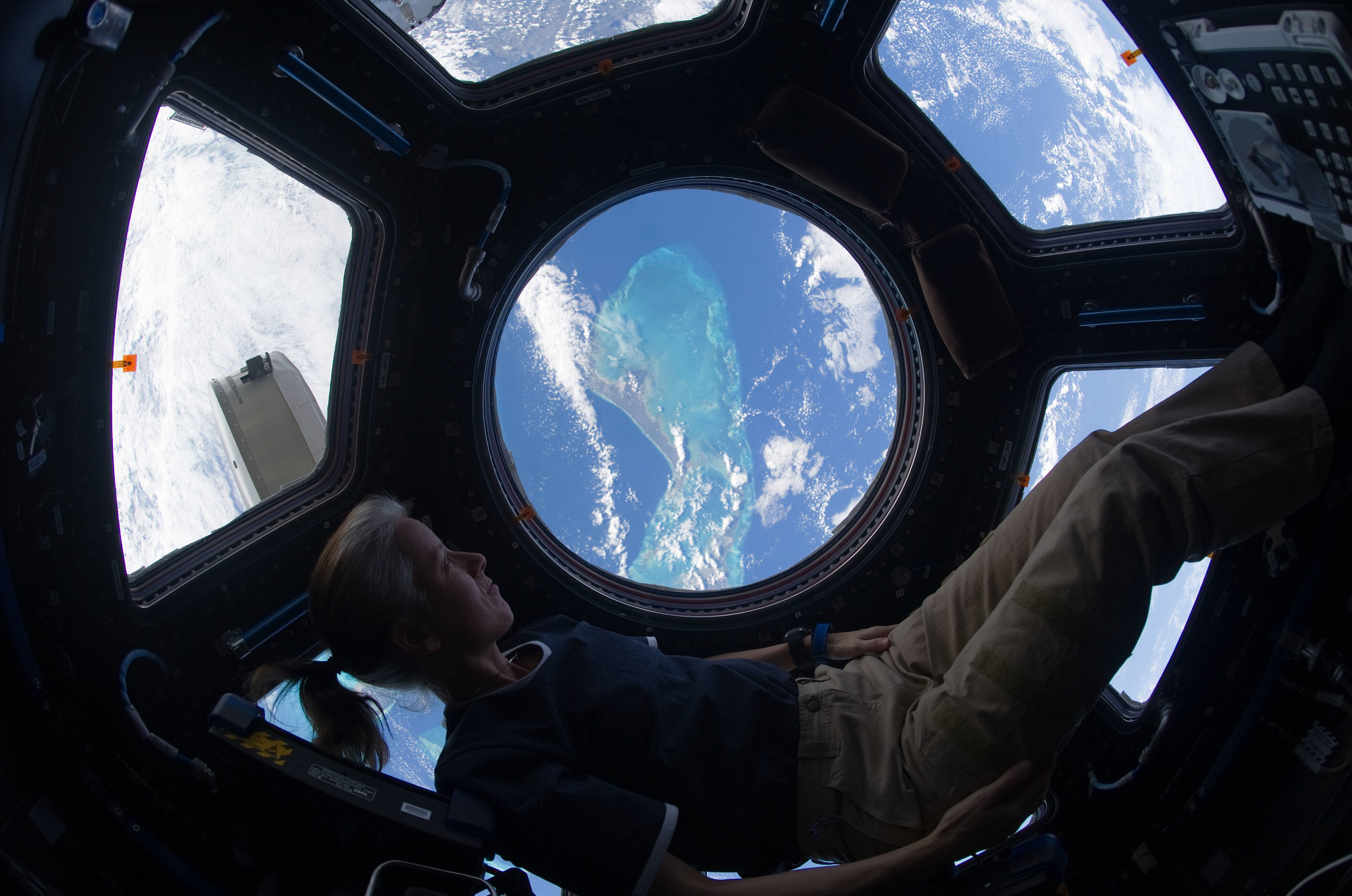 Shannon Walker looking out of the international space station's cupola at the Caribbean view beneath on November 25, 2010.