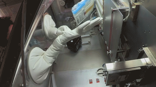animated gif of astronaut Jessica Meir working in a glovebox in space