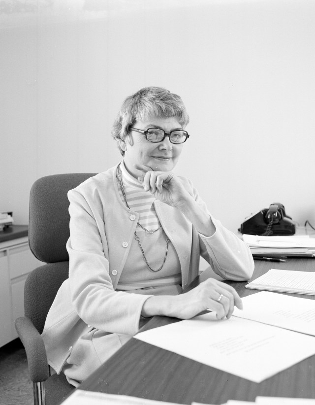Portrait of Peggy Yohner at a desk with paperwork