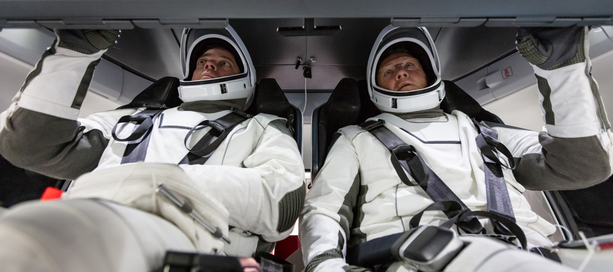 NASA astronauts Doug Hurley and Bob Behnken familiarize themselves with SpaceX’s Crew Dragon