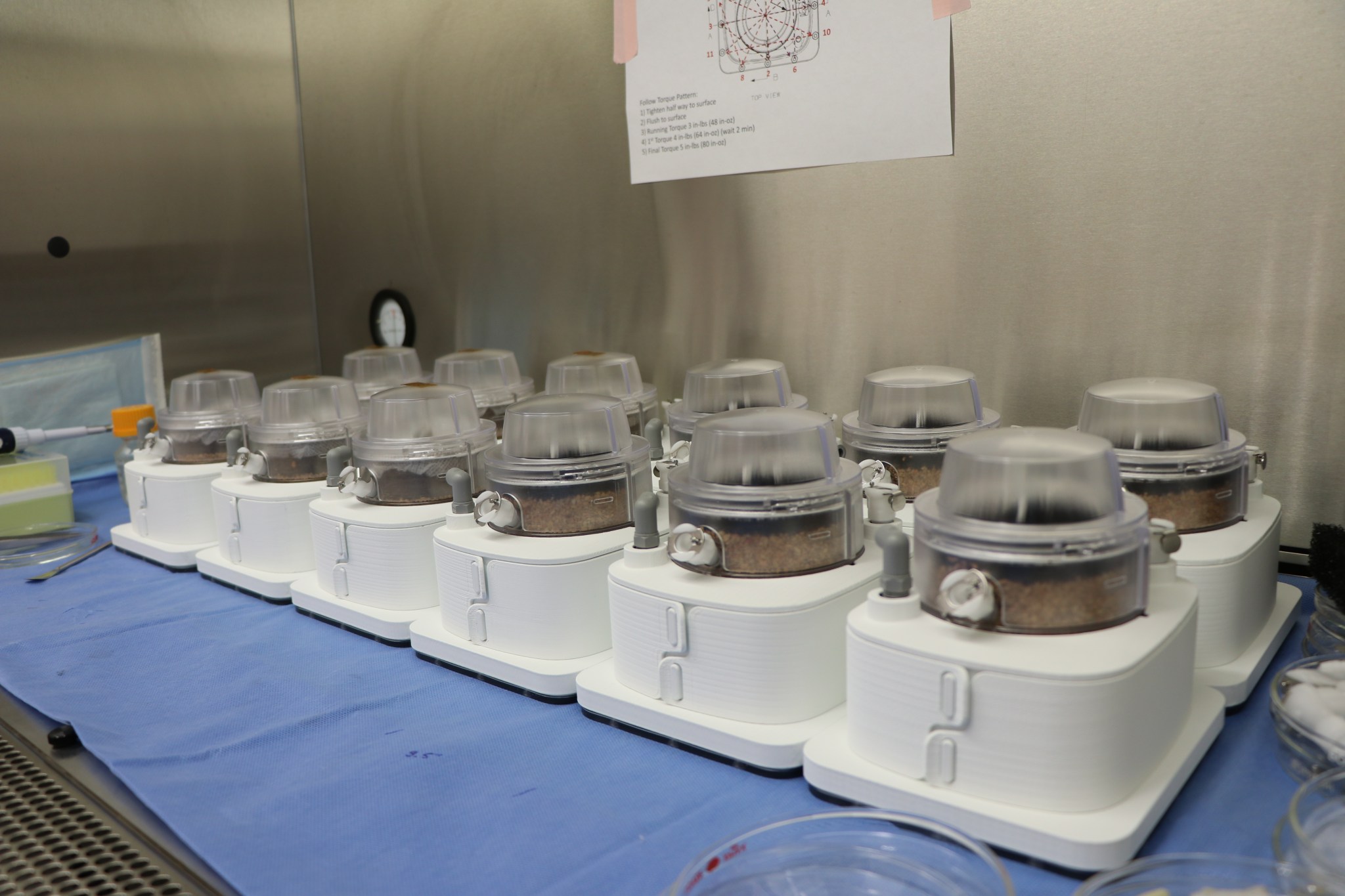 All 12 PONDS units are photographed inside the Space Life Sciences Laboratory at the Kennedy Space Center following assembly.