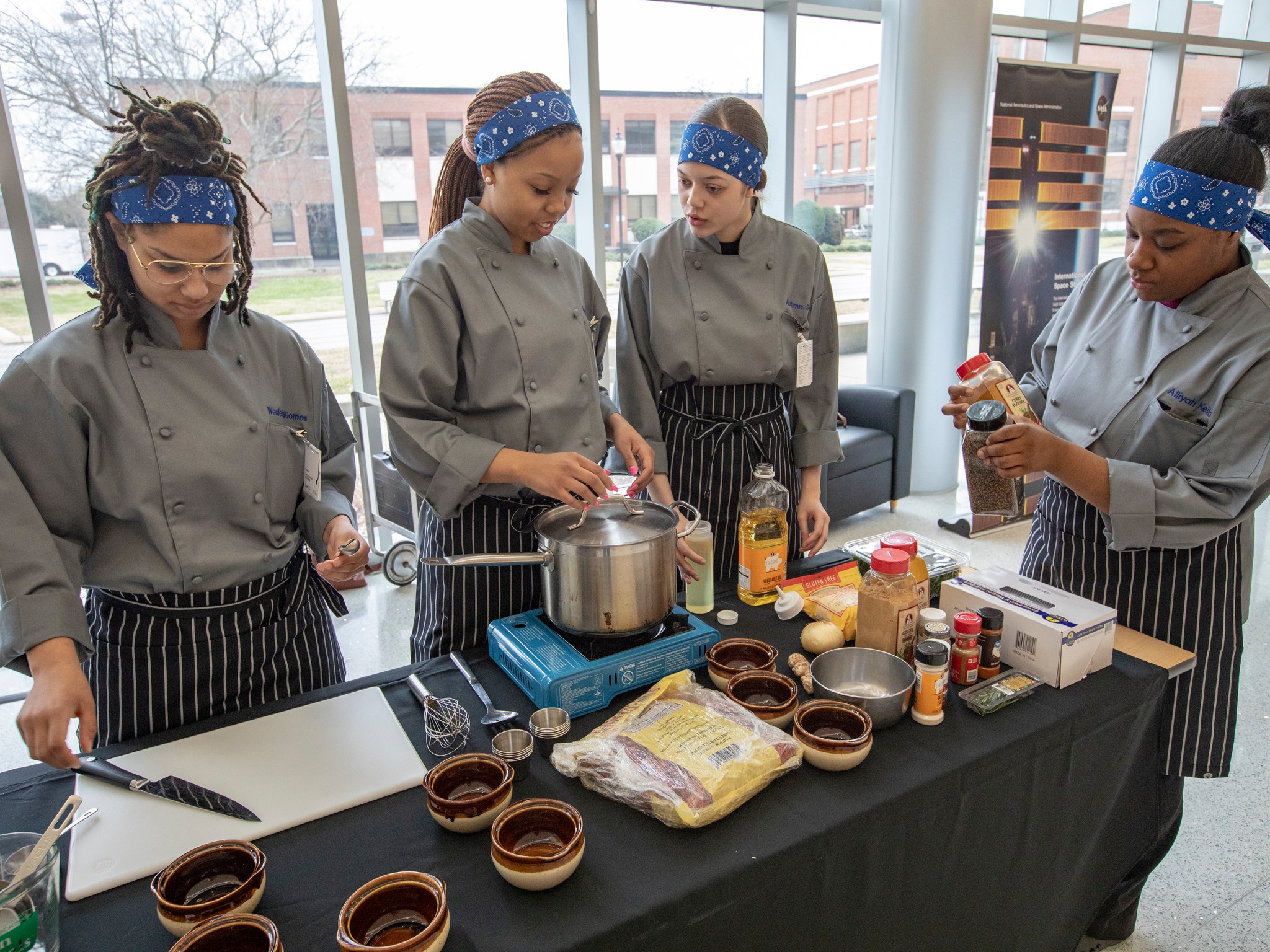 Phoebus High School students prepare their dish for judging Feb. 24 at the HUNCH Culinary Challenge at NASA Langley.