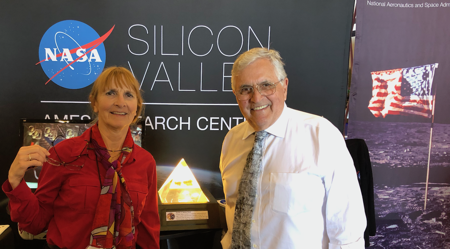 Carol with Apollo Astronaut Harrison (Jack) Schmidt at the Apollo 50th anniversary celebration. Between them in the pyramid is a