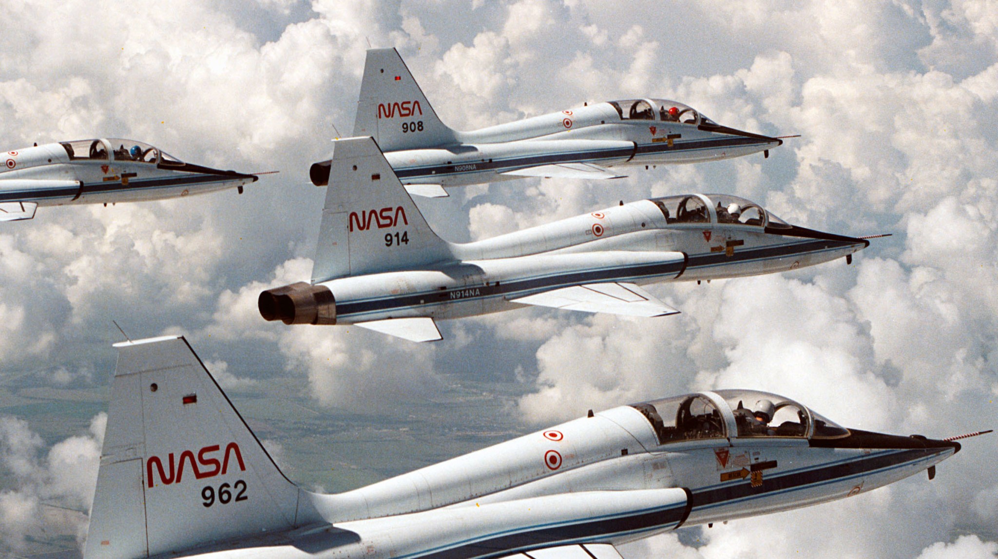 Several NASA T-38 astronaut training jets fly in formation.