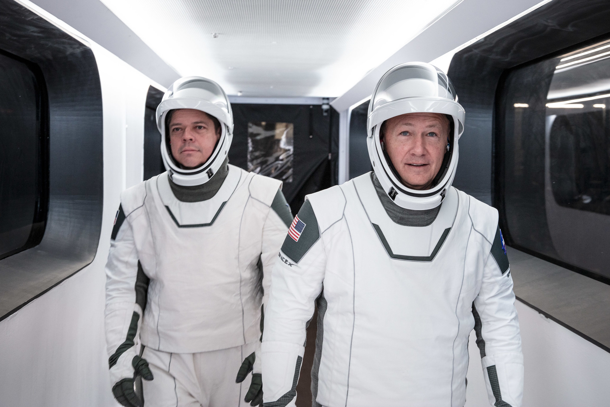 NASA astronauts Bob Behnken, left, and Doug Hurley, wearing SpaceX spacesuits