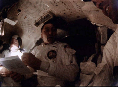 apollo_13_fd5_late_swigert_in_lm_with_checklist