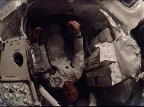 apollo_13_swigert_in_tunnel_entering_lm_late