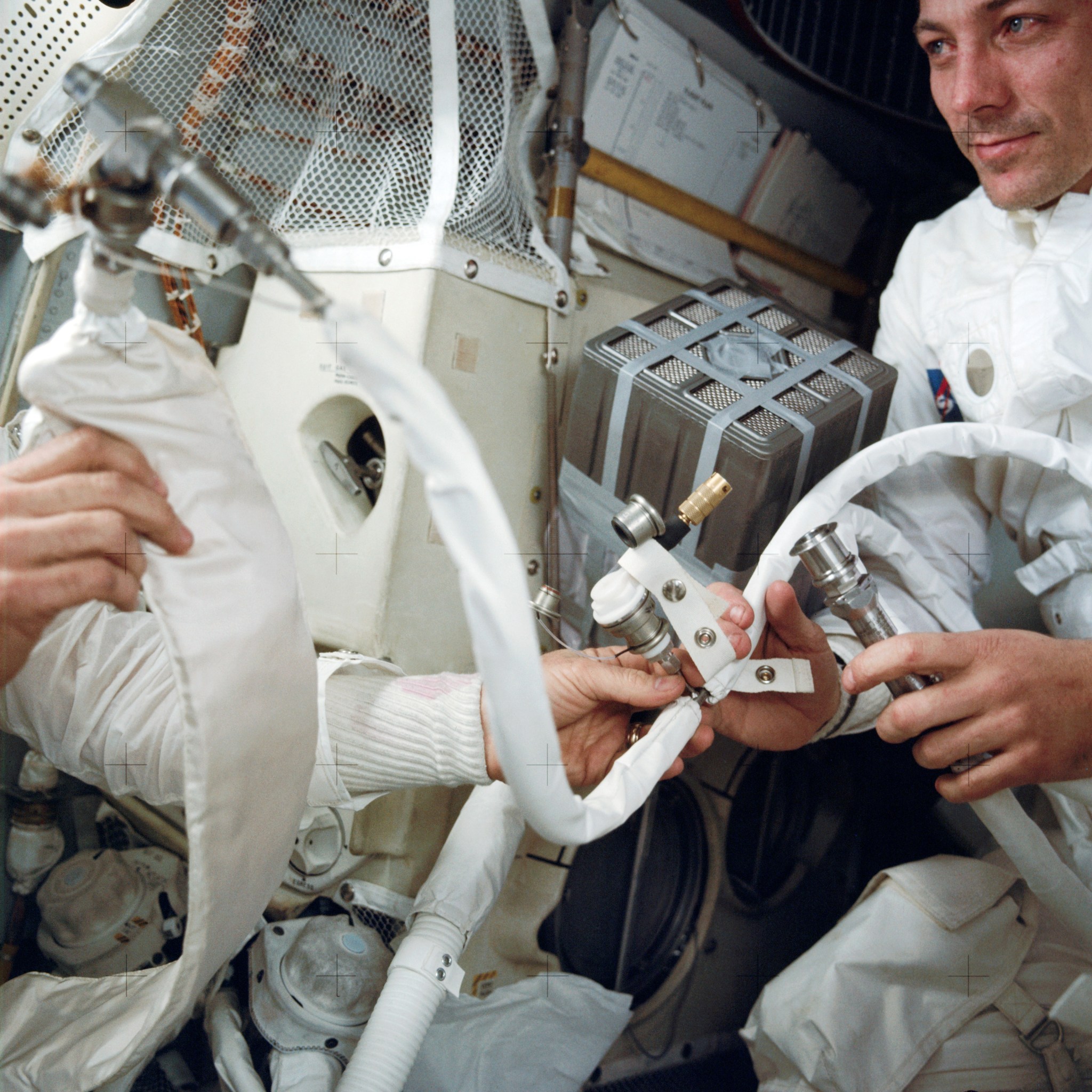 Apollo 13 Crew Installing ?Mail Box? for Purging Carbon Dioxide From Lunar Module?April 14, 1970.