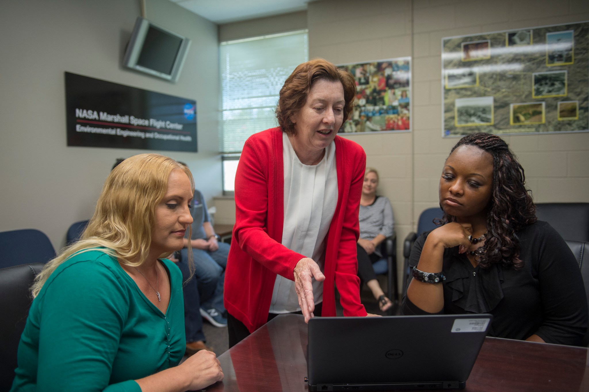 Donna Leach, center, discusses the latest green initiatives with Linda Walker, left, and Felisha Pierce.