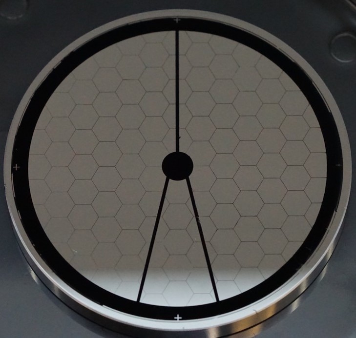 An circular disk, with hexagon shapes.
