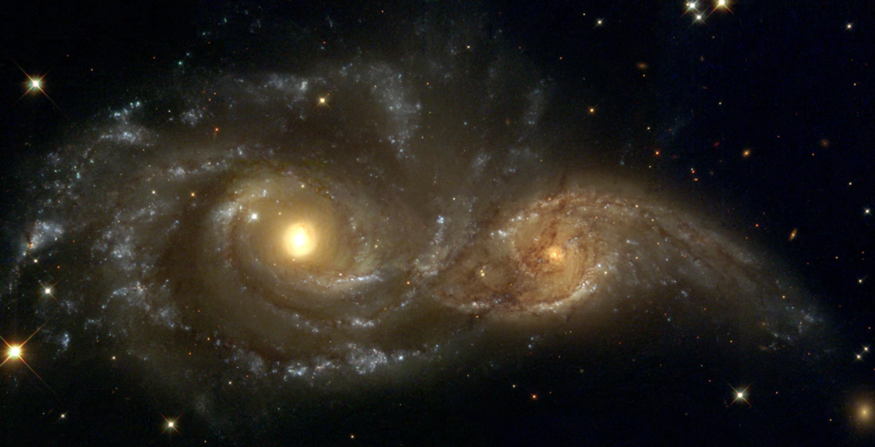 hubble_interacting_spiral_galaxies_ngc_2207_and_ic_2163_2004