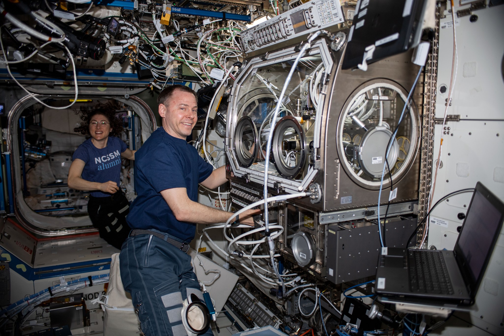 astronaut Nick Hague works on the Ring Sheared Drop investigation inside the space station