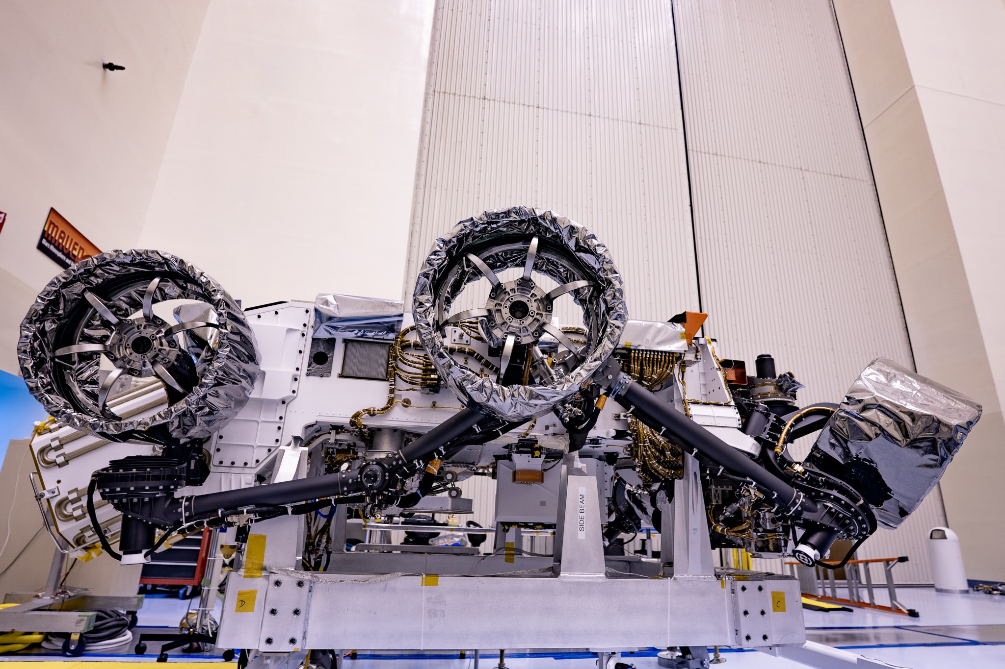 Wheels are installed on NASA's Mars Perseverance rover at Kennedy Space Center