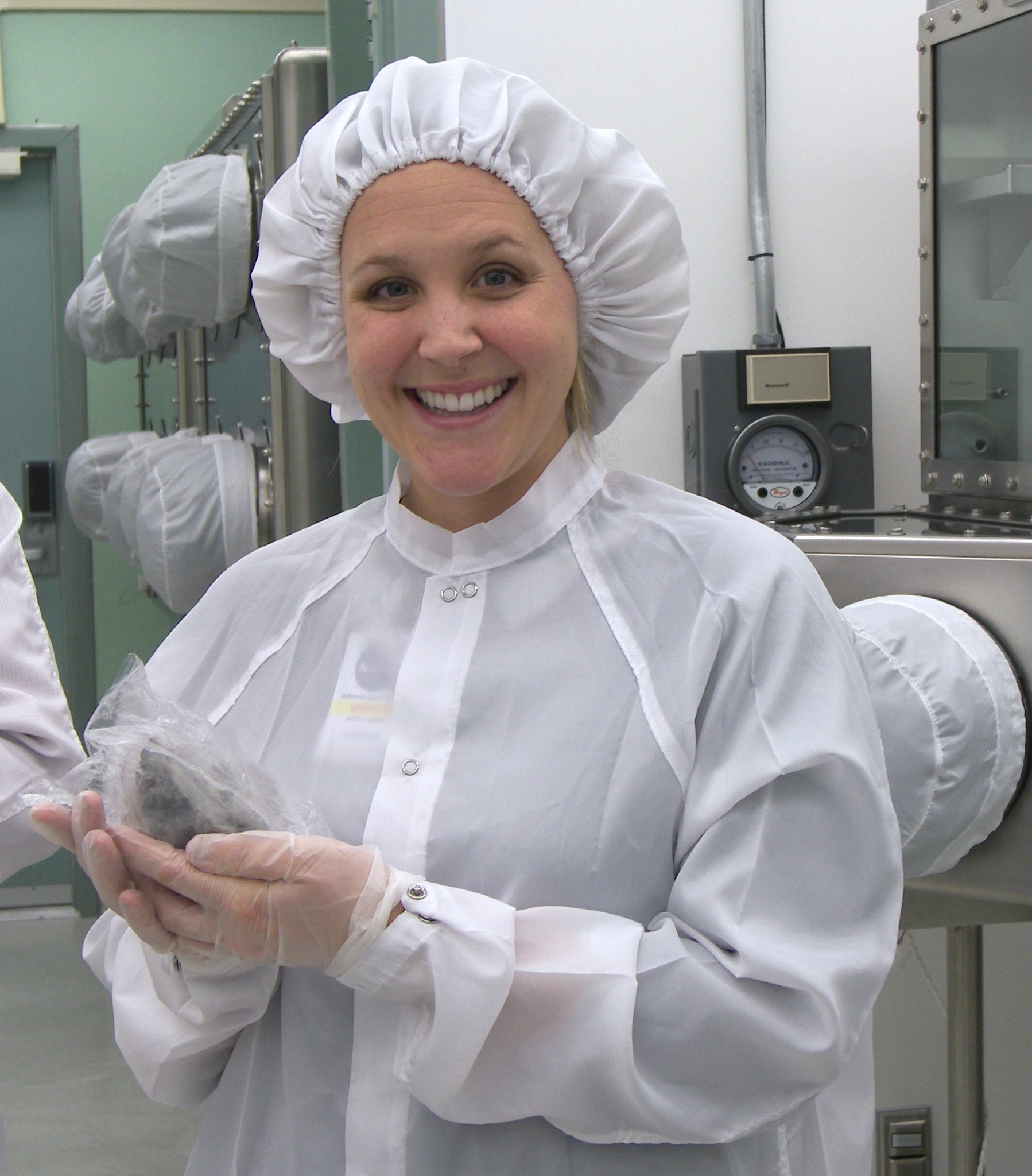Astrobiologist Lindsay Hays holds Martian meteorite ALH84001. 
